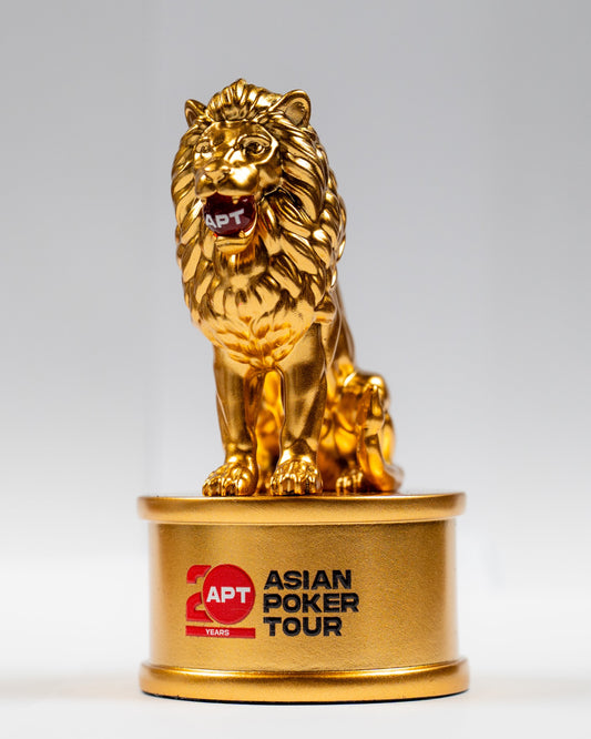 Gold lion trophy with 'Asian Poker Tour' branding on a gray background