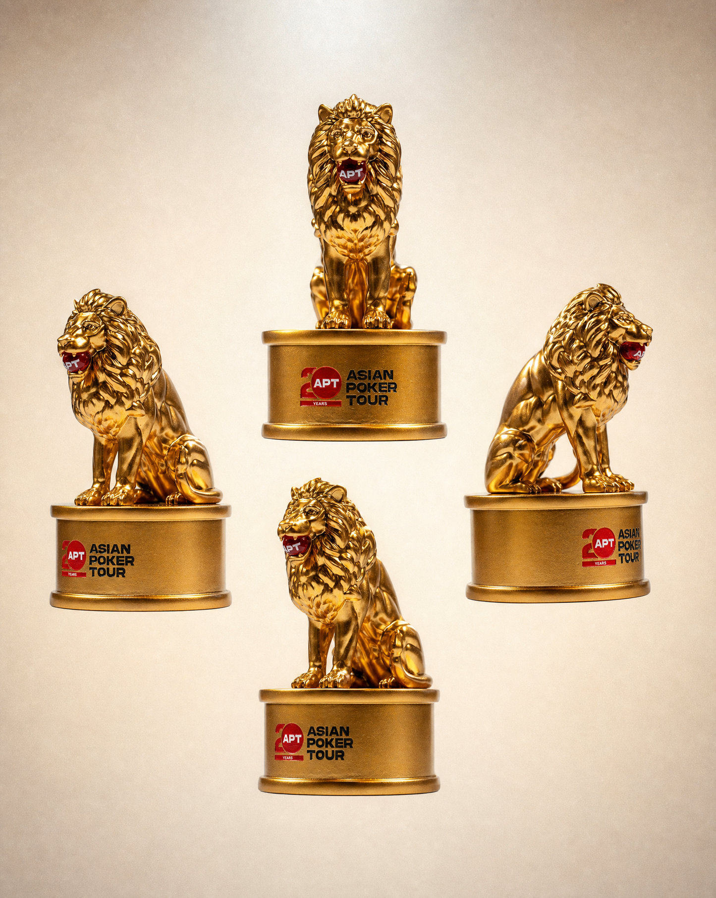 Gold lion-shaped trophies with 'Asian Poker Tour' branding on a beige background